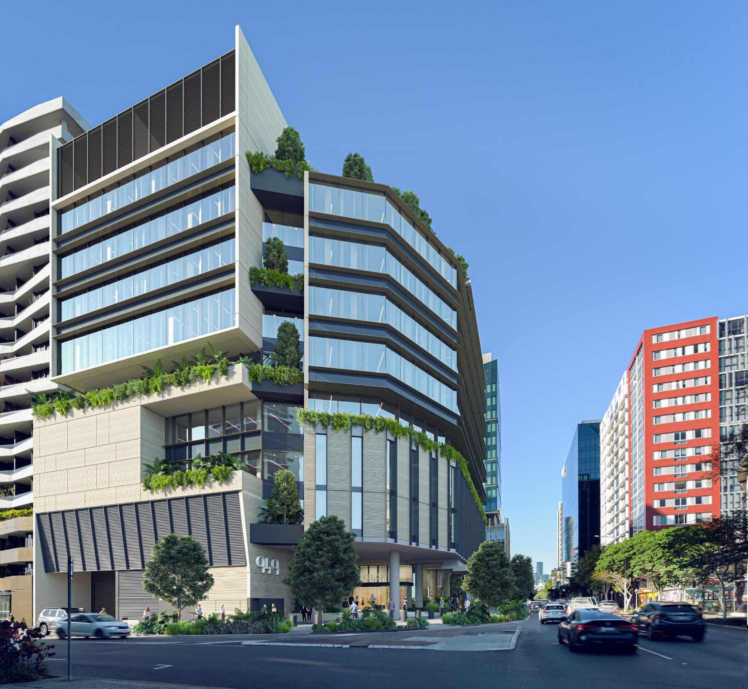 Ground level entry experience at 949 Ann Street with landscaped subtropical planting, pedestrian areas, and a recessed foyer