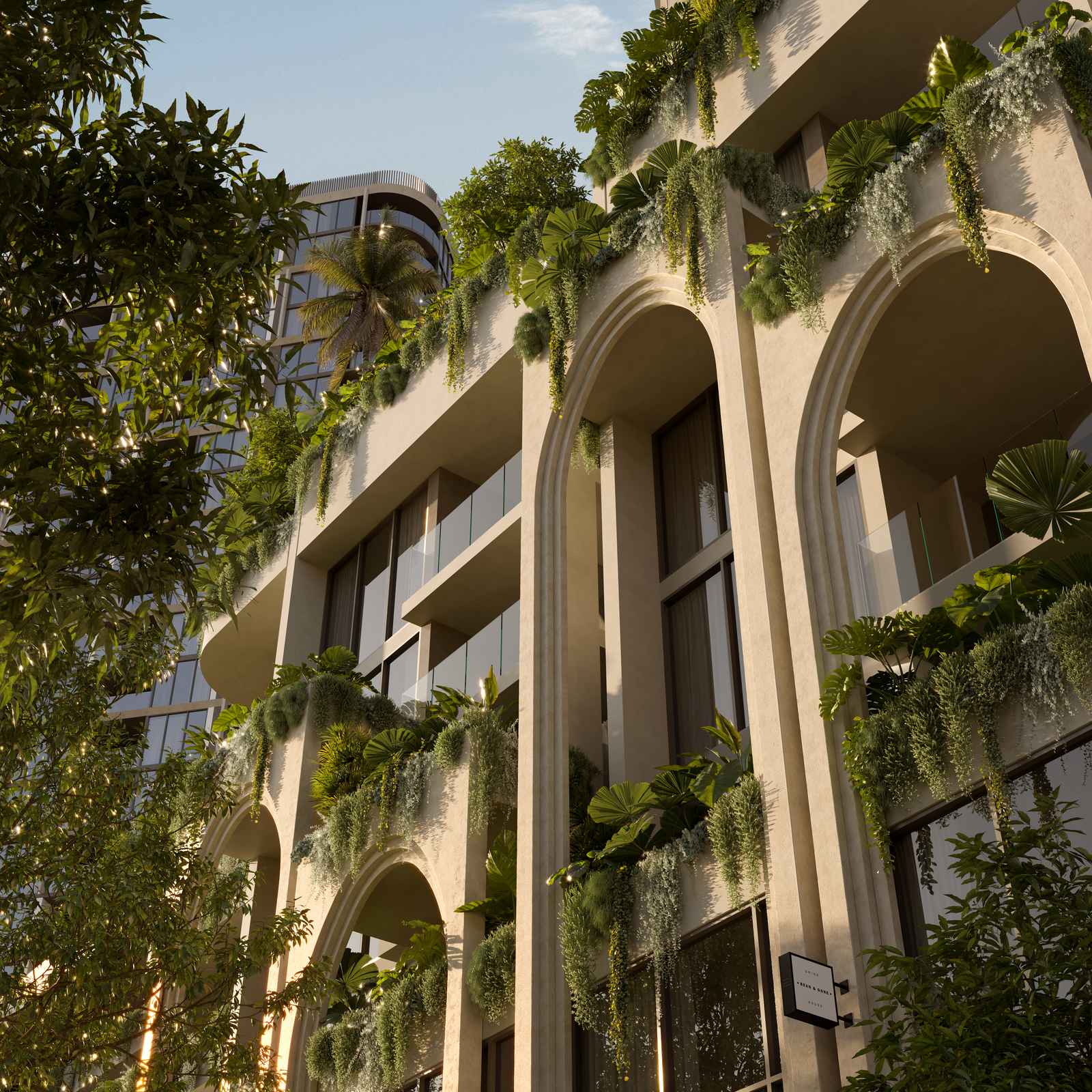 Close up view of the arched facade detailing and landscaped podium at Duet Porta
